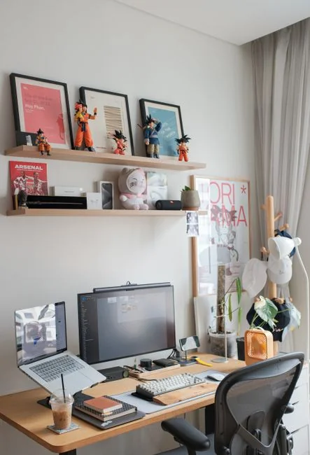 A Lenovo laptop displaying a Facebook login next to a lavender plant indoors.